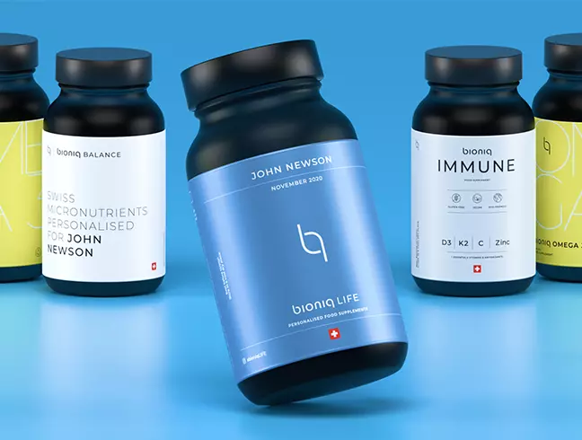 Supplement jars in navy and white with a lowercase mark on a sky-blue backdrop